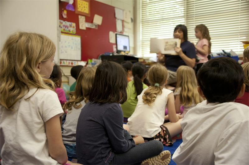 Children listening to their teacher in class