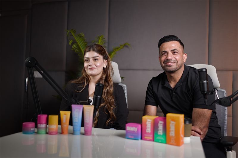 Two presenters promoting skincare products in a studio