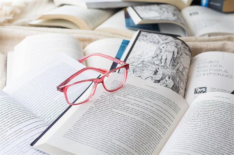 Open books and reading glasses